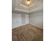 Neutral bedroom featuring decorative ceiling, neutral walls, light carpet and a double door closet at 7214 Bedrock Cir, Lithonia, GA 30038