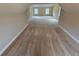 Large bonus room with neutral walls and carpet flooring, suitable for various uses at 7214 Bedrock Cir, Lithonia, GA 30038