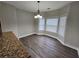 Cozy breakfast nook with hardwood floors, large windows, and modern lighting at 7214 Bedrock Cir, Lithonia, GA 30038