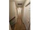 Neutral hallway with carpet flooring and white doors leading to multiple rooms at 7214 Bedrock Cir, Lithonia, GA 30038