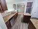 Well-equipped kitchen with granite countertops, stainless steel appliances, and hardwood floors at 7214 Bedrock Cir, Lithonia, GA 30038