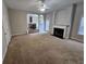 Bright living room with fireplace and open access to kitchen and dining areas at 7214 Bedrock Cir, Lithonia, GA 30038