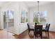 Bright breakfast nook featuring hardwood floors, backyard views, and modern lighting at 965 Boulevard Se # B, Atlanta, GA 30312