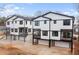 Well-lit townhouse complex featuring balconies, black framed windows, and garage parking at 965 Boulevard Se # B, Atlanta, GA 30312