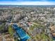 Scenic aerial view of multi-Gathering residences surrounded by trees, tennis courts and parking at 1179 Church St # J, Decatur, GA 30030