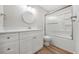 Bright bathroom with shower and tub combination, modern vanity and light-colored walls at 1179 Church St # J, Decatur, GA 30030