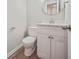 A powder room features vanity and lighting at 1179 Church St # J, Decatur, GA 30030