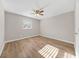 A bedroom with a ceiling fan, a window, and light-colored walls at 1179 Church St # J, Decatur, GA 30030