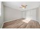 Bedroom with ceiling fan, two doors, and lots of natural light from a nearby window at 1179 Church St # J, Decatur, GA 30030