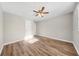 This bright bedroom features a ceiling fan, light-colored walls, and beautiful light flooring at 1179 Church St # J, Decatur, GA 30030