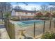 Inviting community pool area surrounded by a fence, trees and multi-Gathering homes at 1179 Church St # J, Decatur, GA 30030