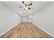 Empty living room showcasing wood floors, neutral paint and ceiling fan at 1179 Church St # J, Decatur, GA 30030