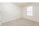 Well-lit bedroom featuring neutral carpet, a large window, and freshly painted walls at 2750 Dominion Walk Ln, Snellville, GA 30078