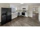 Well-lit kitchen with stainless steel appliances, white cabinets, and ample counter space at 3764 Cherokee Overlook Dr, Canton, GA 30115