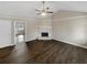 Bright and airy living room with vaulted ceiling and stone fireplace, showcasing its spacious layout at 3764 Cherokee Overlook Dr, Canton, GA 30115