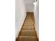 Carpeted staircase with wood treads and white risers, leading to the upper level of the home at 3764 Cherokee Overlook Dr, Canton, GA 30115