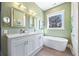 The bathroom features a double sink vanity with bathtub, modern fixtures, and tile floor at 4115 Merritt Dr, Cumming, GA 30041