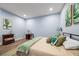 Bright bedroom with hardwood floors and light blue walls provides a peaceful retreat at 4115 Merritt Dr, Cumming, GA 30041