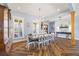 Open dining room features a long table, shuttered windows, and wood floors at 4115 Merritt Dr, Cumming, GA 30041