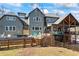 Beautiful home exterior featuring a large deck, pool and manicured lawn, perfect for outdoor entertaining at 4115 Merritt Dr, Cumming, GA 30041