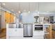 Modern kitchen island with stainless steel sink and appliances and granite countertops at 4115 Merritt Dr, Cumming, GA 30041