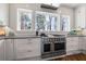 Bright, modern kitchen features stainless appliances, white subway tile and large windows at 4115 Merritt Dr, Cumming, GA 30041