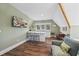 This kitchenette has a breakfast bar with marble countertop, and wood flooring at 4115 Merritt Dr, Cumming, GA 30041