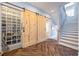 Walk-in pantry with wood sliding doors, custom shelves, and a rolling ladder at 4115 Merritt Dr, Cumming, GA 30041