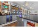 Close-up of the wet bar area with dual beverage refrigerators and outdoor views at 4115 Merritt Dr, Cumming, GA 30041