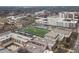 Aerial shot of Decatur Bulldogs Football Field surrounded by school buildings, rooftops, and trees at 10 Clarke Hill St, Decatur, GA 30030