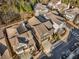 An aerial view shows a residential neighborhood featuring well-maintained homes and landscaping at 10 Clarke Hill St, Decatur, GA 30030