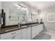 Well-appointed bathroom featuring a double vanity, sleek lighting, and a luxurious glass-enclosed shower with soaking tub at 10 Clarke Hill St, Decatur, GA 30030