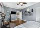 Spacious bedroom with hardwood floors, neutral walls, and decorated with interesting wall art at 10 Clarke Hill St, Decatur, GA 30030