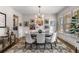 Bright dining room featuring stylish light fixture, large windows, and ample space for entertaining guests at 10 Clarke Hill St, Decatur, GA 30030