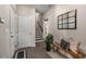 Inviting entryway with tile flooring, bench seating, mirror and coat closet provides plenty of space at 10 Clarke Hill St, Decatur, GA 30030