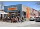 Farm Burger restaurant exterior showing the outdoor seating area and the cow mural on the building at 10 Clarke Hill St, Decatur, GA 30030