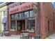 Charming brick building with a vintage storefront, featuring large windows and unique signage at 10 Clarke Hill St, Decatur, GA 30030