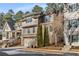 Charming two-story home showcasing its exterior details, including a garage, front porch, and professionally landscaped surroundings at 10 Clarke Hill St, Decatur, GA 30030