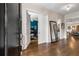 Elegant foyer features hardwood floors, high ceilings, and views into other living spaces of the home at 10 Clarke Hill St, Decatur, GA 30030