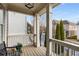 Welcoming front porch showcasing classic railing and columns, perfect for enjoying the neighborhood views at 10 Clarke Hill St, Decatur, GA 30030