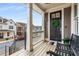 Inviting front porch featuring a bench and a stylish black front door adorned with a green wreath at 10 Clarke Hill St, Decatur, GA 30030