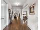 Inviting hallway with gleaming hardwood floors, leading to various rooms, and adorned with stylish decor at 10 Clarke Hill St, Decatur, GA 30030