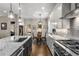 Modern kitchen featuring granite countertops, stainless steel appliances, and a view into the dining area at 10 Clarke Hill St, Decatur, GA 30030