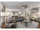 Spacious living room featuring hardwood floors, a large sectional sofa, and an open floor plan at 10 Clarke Hill St, Decatur, GA 30030