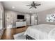 Spacious main bedroom with hardwood floors, a TV, and a dresser, creating a relaxing and functional space at 10 Clarke Hill St, Decatur, GA 30030