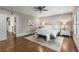 Elegant main bedroom showcasing hardwood floors, plush bedding, and a stylish bench, creating a serene retreat at 10 Clarke Hill St, Decatur, GA 30030