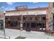 The Iberian Pig restaurant with an exposed brick exterior, large windows, and outdoor seating at 10 Clarke Hill St, Decatur, GA 30030