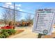 A 'Walk There!' sign displaying walking times to local destinations around the Oakhurst Business District at 10 Clarke Hill St, Decatur, GA 30030