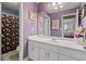 Charming bathroom featuring a white vanity, large mirror, and shower with patterned curtain at 21 Cass Station Pass Nw Pass, Cartersville, GA 30121