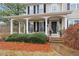 Charming home featuring a covered front porch, beautiful landscaping, and elegant details at 21 Cass Station Pass Nw Pass, Cartersville, GA 30121